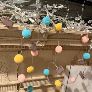 Pusheen Pastel String Lights with Blue, Yellow, and Pink Pom Poms